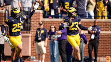 Michigan linebacker Cole Sullivan (23) celebrates an interception against Washington during the second half at Michigan Stadium in Ann Arbor on Saturday, Oct. 18, 2025.