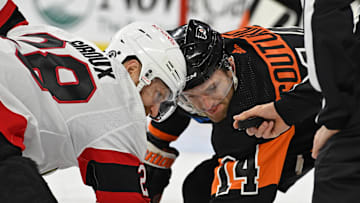 Jan 21, 2024; Philadelphia, Pennsylvania, USA; Ottawa Senators right wing Claude Giroux (28) and Philadelphia Flyers center Sean Couturier (14) face off during the first period at Wells Fargo Center.