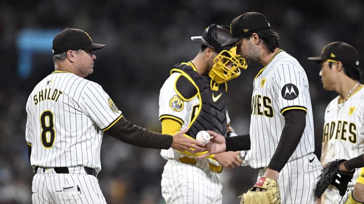 Jul 6, 2024; San Diego, California, USA; San Diego Padres manager Mike Shildt (8) takes the ball from starting pitcher Matt Waldron (61) during a pitching change in the seventh inning against the Arizona Diamondbacks at Petco Park. Mandatory Credit: Orlando Ramirez-USA TODAY Sports