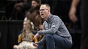 Mar 7, 2025; Kansas City, MO, USA; West Virginia Mountaineers head coach Mark Kellogg looks on from the sideline in the first quarter against the Kansas State Wildcats at T-Mobile Center.