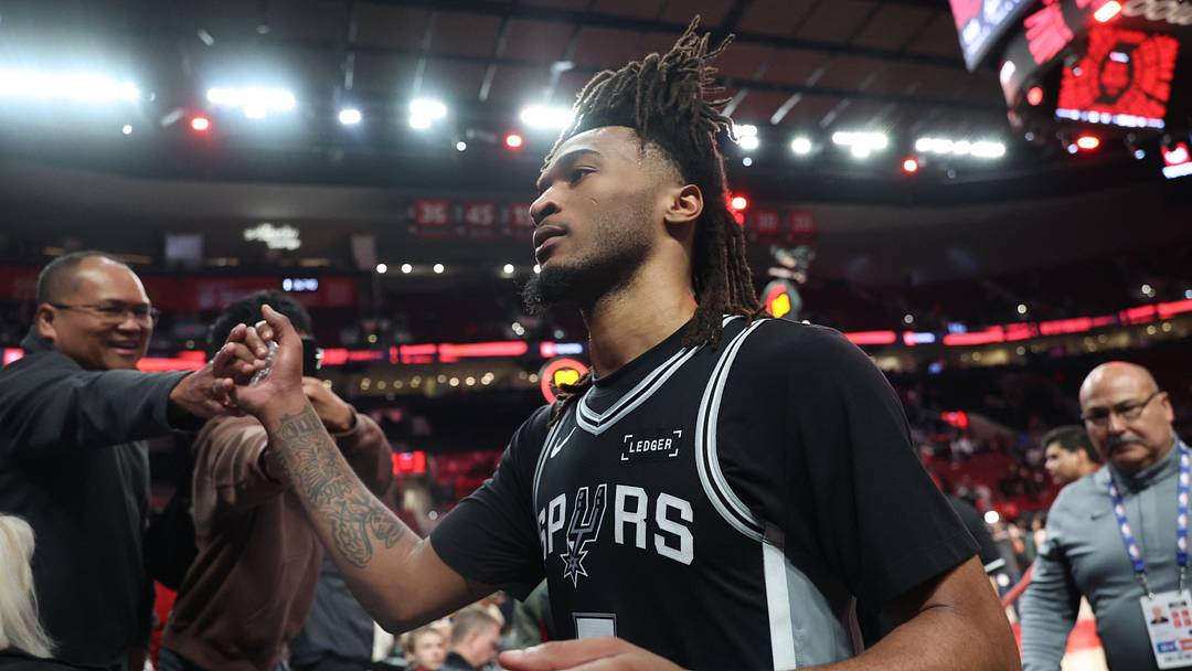 Apr 24, 2026; Portland, Oregon, USA; San Antonio Spurs guard Stephon Castle (5) high-fives fans after the Spurs defeated the Portland Trail Blazers in game three of the first round of the 2026 NBA Playoffs at Moda Center. Mandatory Credit: Jaime Valdez-Imagn Images
