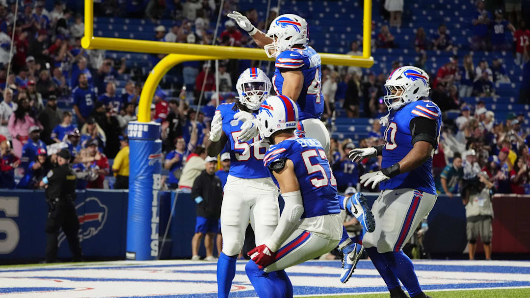Sep 23, 2024; Orchard Park, New York, USA; Buffalo Bills linebacker Joe Andreessen (44) and defensive end AJ Epenesa (57) congratulate defensive end Javon Solomon (56) for causing a fumble during the second half against the Jacksonville Jaguars at Highmark Stadium. 