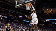 Mar 27, 2025; Newark, NJ, USA; Alabama Crimson Tide center Clifford Omoruyi (11) dunks the ball against Brigham Young Cougars forward Mawot Mag (0) during the second half during an East Regional semifinal of the 2025 NCAA tournament at Prudential Center.