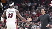Apr 16, 2025; Chicago, Illinois, USA; Miami Heat head coach Erik Spoelstra shakes hands with center Bam Adebayo (13) during the first quarter at United Center. Mandatory Credit: David Banks-Imagn Images