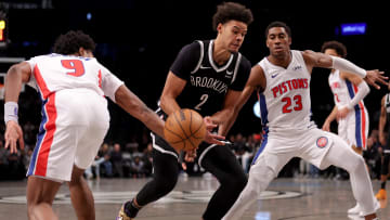 Dec 23, 2023; Brooklyn, New York, USA; Detroit Pistons forward Ausar Thompson (9) knocks the ball away from Brooklyn Nets forward Cameron Johnson (2) as he drives to the basket against Pistons guard Jaden Ivey (23): Brad Penner-USA TODAY Sports