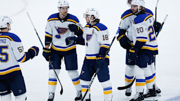 Dec 3, 2024; Winnipeg, Manitoba, CAN;  St. Louis Blues forward Robert Thomas (18) is congratulated by his teammates on his goal against the Winnipeg Jets during the third period at Canada Life Centre. Mandatory Credit: Terrence Lee-Imagn Images