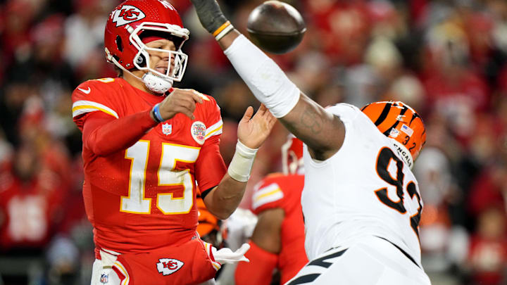 Kansas City Chiefs quarterback Patrick Mahomes (15) throws under presser by Cincinnati Bengals defensive tackle BJ Hill (92) in the third quarter during a Week 17 NFL football game between the Cincinnati Bengals and the Kansas City Chiefs, Sunday, Dec. 31, 2023, at GEHA Field at Arrowhead Stadium in Kansas City, Mo. The Kansas City Chiefs won, 25-17.