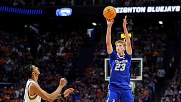 Mar 22, 2025; Lexington, KY, USA;  Creighton Bluejays forward Jackson McAndrew (23) shoots the ball against Auburn Tigers guard Chad Baker-Mazara (10) during the second half in the second round to the NCAA Tournament at Rupp Arena. Mandatory Credit: Jordan Prather-Imagn Images