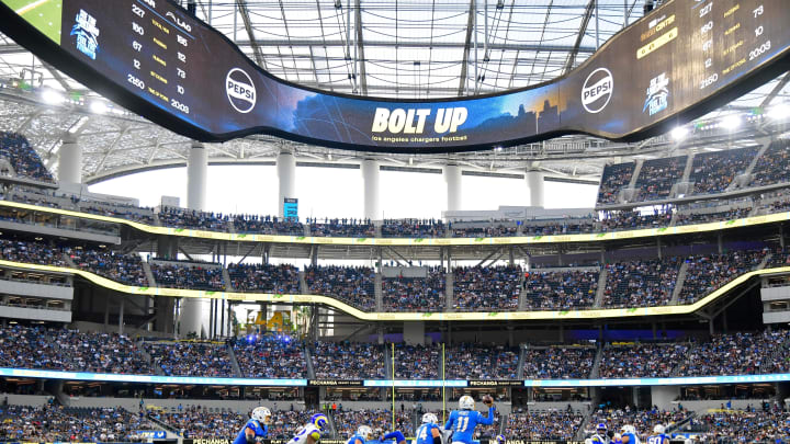 Aug 17, 2024; Inglewood, California, USA; Los Angeles Chargers quarterback Luis Perez (11) moves out to pass against the Los Angeles Rams during the second half at SoFi Stadium. Mandatory Credit: Gary A. Vasquez-USA TODAY Sports