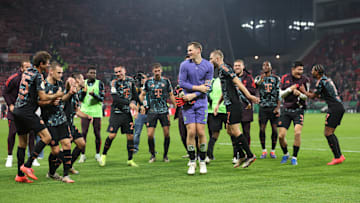 Bayern Munich players celebrating with fans after win against Mainz in the second round of DFB Pokal.