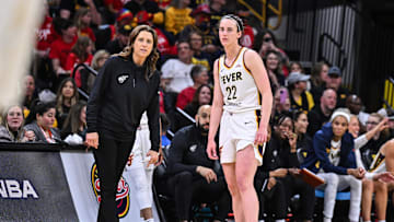 May 4, 2025; Iowa City, IA, USA; Indiana Fever guard Caitlin Clark (22) looks on with head coach Stephanie White during the third quarter against the Brazil National Team at Carver-Haweye Arena. Mandatory Credit: Jeffrey Becker-Imagn Images