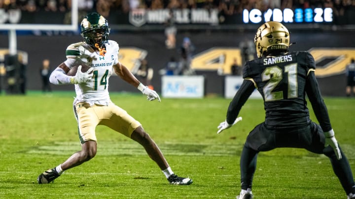 CSU football's senior wide receiver Tory Horton (14) makes a move in the open field against CU's Shilo Sanders in the Rocky Mountain Showdown on Sept. 16, 2023 at Folsom Field in Boulder, Colo.