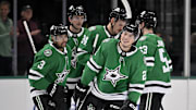 Nov 20, 2024; Dallas, Texas, USA; Dallas Stars defenseman Mathew Dumba (3) and center Wyatt Johnston (53) and left wing Jason Robertson (21) and defenseman Thomas Harley (55) and center Roope Hintz (24) celebrates a goal scored by Robertson against the San Jose Sharks during the first period at the American Airlines Center. Mandatory Credit: Jerome Miron-Imagn Images