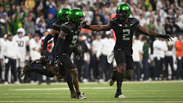 Dec 7, 2024; Indianapolis, IN, USA; Oregon Ducks defensive back Nikko Reed (9) reacts after an interception against the Penn State Nittany Lions during the fourth quarter in the 2024 Big Ten Championship game at Lucas Oil Stadium.