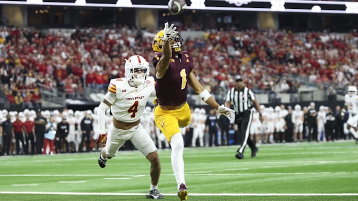 Dec 7, 2024; Arlington, TX, USA;  Arizona State Sun Devils wide receiver Xavier Guillory (1) tries to catch a pass Iowa State Cyclones defensive back Jeremiah Cooper (4) defends during the first quarter at AT&T Stadium.