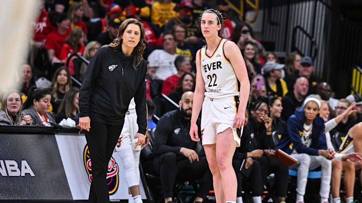 May 4, 2025; Iowa City, IA, USA; Indiana Fever guard Caitlin Clark (22) looks on with head coach Stephanie White during the third quarter against the Brazil National Team at Carver-Haweye Arena. Mandatory Credit: Jeffrey Becker-Imagn Images May 4, 2025; Iowa City, IA, USA; Indiana Fever guard Caitlin Clark (22) looks on with head coach Stephanie White during the third quarter against the Brazil National Team at Carver-Haweye Arena. Mandatory Credit: Jeffrey Becker-Imagn Images