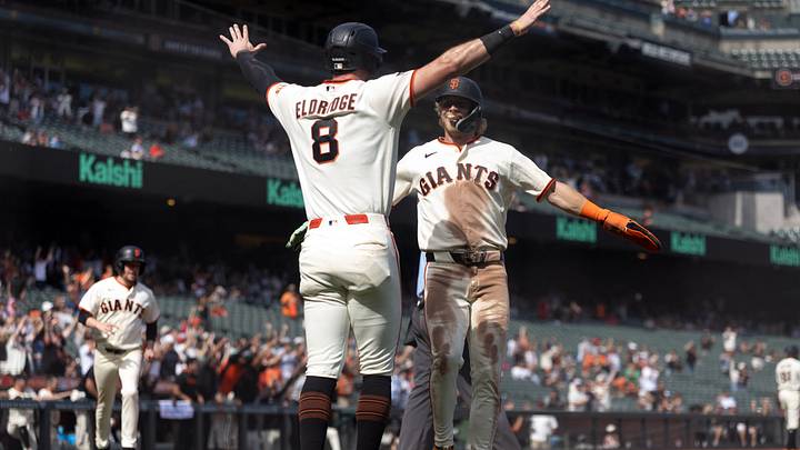 Sep 9, 2026; San Francisco, California, USA;  San Francisco Giants first baseman Bryce Eldridge (8) and center fielder Jonah Cox (53) embrace after scoring the tying runs against the St. Louis Cardinals during the eighth inning at Oracle Park.  Mandatory Credit: D. Ross Cameron-Imagn Images