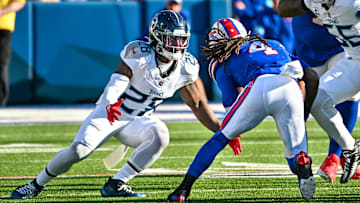Oct 20, 2024; Orchard Park, New York, USA; Tennessee Titans safety Quandre Diggs (28) looks to make a tackle on Buffalo Bills running back James Cook (4) in the fourth quarter at Highmark Stadium. Mandatory Credit: Mark Konezny-Imagn Images