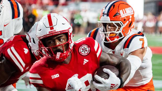 Nebraska Cornhuskers wide receiver Isaiah Neyor (18) runs after a catch against Illinois Fighting Illini Nebraska Cornhuskers wide receiver Isaiah Neyor (18) runs after a catch against Illinois Fighting Illini