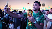 Saudi Arabian fans celebrate their successful bid