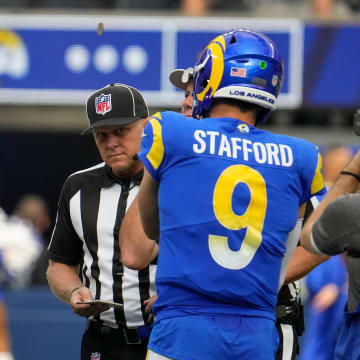 Oct 24, 2021; Inglewood, California, USA; Detroit Lions quarterback Jared Goff (16) and Los Angeles Rams quarterback Matthew Stafford (9) during the coin flip before the start of the Rams-Lions game at SoFi Stadium. Mandatory Credit: Robert Hanashiro-USA TODAY Sports