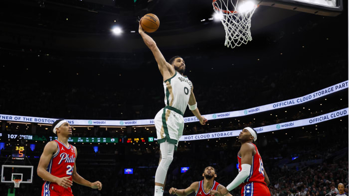 Feb 27, 2024; Boston, Massachusetts, USA; Boston Celtics forward Jayson Tatum (0) goes in for a dunk vs. the Philadelphia 76ers.