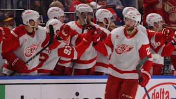 Oct 26, 2024; Buffalo, New York, USA;  Detroit Red Wings center Michael Rasmussen (27) celebrates his goal with teammates during the second period against the Buffalo Sabres at KeyBank Center. Mandatory Credit: Timothy T. Ludwig-Imagn Images