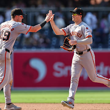 Sep 8, 2024; San Diego, California, USA; San Francisco Giants shortstop Tyler Fitzgerald (49) and San Francisco Giants right fielder Mike Yastrzemski (5) celebrate after defeating the San Diego Padres at Petco Park. 