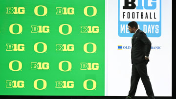 Jul 25, 2024; Indianapolis, IN, USA; Oregon Ducks head coach ??Dan Lanning walks to the podium before addressing the media during the Big 10 football media day at Lucas Oil Stadium. Mandatory Credit: Robert Goddin-USA TODAY Sports