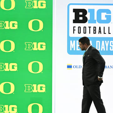 Jul 25, 2024; Indianapolis, IN, USA; Oregon Ducks head coach Dan Lanning walks to the podium before addressing the media during the Big 10 football media day at Lucas Oil Stadium.