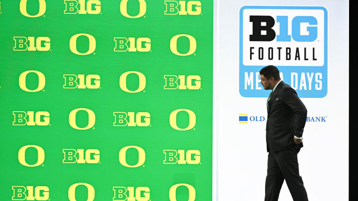 Jul 25, 2024; Indianapolis, IN, USA; Oregon Ducks head coach Dan Lanning walks to the podium before addressing the media during the Big 10 football media day at Lucas Oil Stadium.