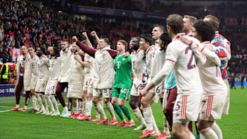 Bayern Munich players celebrating after defeating Bayer Leverkusen in the Champions League.