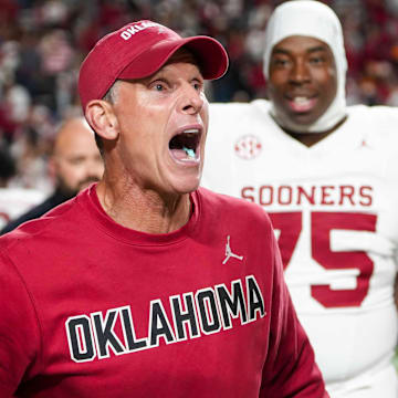 Oklahoma coach Brent Venables celebrates with his players after his team beat Tennessee at Neyland Stadium in Knoxville, Tenn., on November 1.