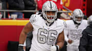 Dec 25, 2023; Kansas City, Missouri, USA; Las Vegas Raiders guard Dylan Parham (66) runs onto the field against the Kansas City Chiefs prior to a game at GEHA Field at Arrowhead Stadium. Mandatory Credit: Denny Medley-Imagn Images