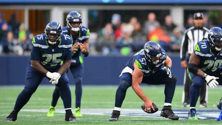 Nov 3, 2024; Seattle, Washington, USA; Seattle Seahawks center Connor Williams (57) snaps the ball to quarterback Geno Smith (7) during the second half against the Los Angeles Rams at Lumen Field. Nov 3, 2024; Seattle, Washington, USA; Seattle Seahawks center Connor Williams (57) snaps the ball to quarterback Geno Smith (7) during the second half against the Los Angeles Rams at Lumen Field.