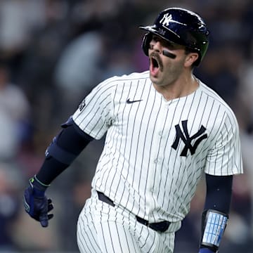 Sep 9, 2024; Bronx, New York, USA; New York Yankees catcher Austin Wells (28) reacts as he rounds the bases after hitting a three run home run against the Kansas City Royals during the seventh inning at Yankee Stadium. Mandatory Credit: Brad Penner-Imagn Images