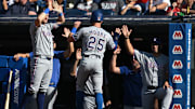 Sep 28, 2025; Cleveland, Ohio, USA;  Texas Rangers second baseman Dylan Moore (25) celebrates after scoring during the second inning against the Cleveland Guardians at Progressive Field. 