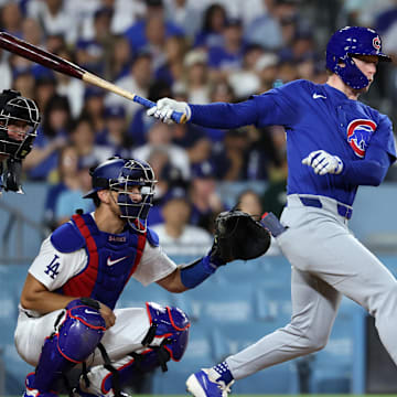 Sep 10, 2024; Los Angeles, California, USA;  Chicago Cubs center fielder Pete Crow-Armstrong (52) hits a RBI single during the second inning against the Los Angeles Dodgers at Dodger Stadium. 