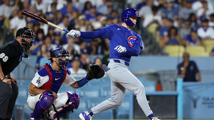 Sep 10, 2024; Los Angeles, California, USA;  Chicago Cubs center fielder Pete Crow-Armstrong (52) hits a RBI single during the second inning against the Los Angeles Dodgers at Dodger Stadium. 