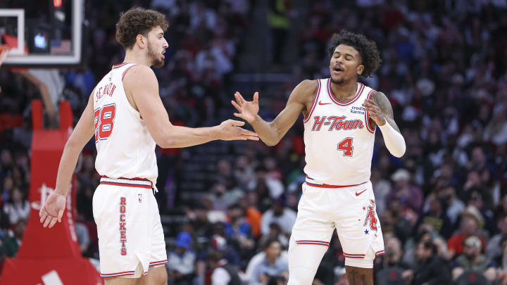 Jan 6, 2024; Houston, Texas, USA; Houston Rockets guard Jalen Green (4) celebrate with center Alperen Sengun (28) after a play during the second quarter against the Milwaukee Bucks at Toyota Center. Mandatory Credit: Troy Taormina-USA TODAY Sports