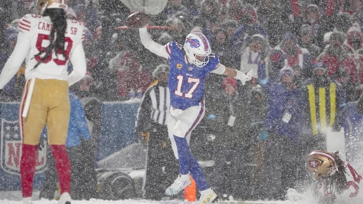 Buffalo Bills quarterback Josh Allen runs for a touchdown against the San Francisco 49ers at Highmark Stadium. Buffalo Bills quarterback Josh Allen runs for a touchdown against the San Francisco 49ers at Highmark Stadium.
