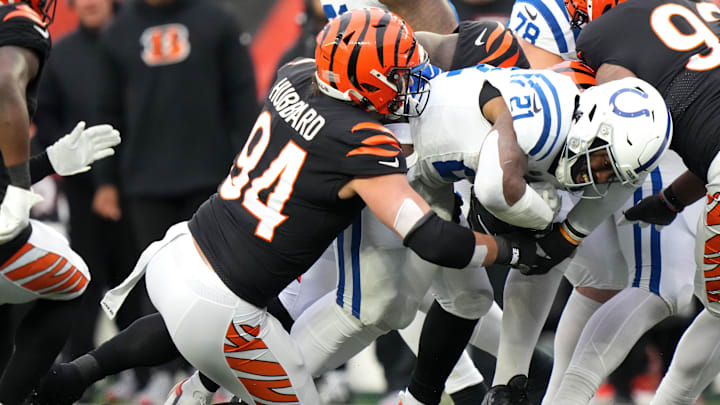 Cincinnati Bengals defensive end Sam Hubbard (94) tackles Indianapolis Colts running back Zack Moss (21) in the first quarter during a Week 14 NFL game between the Indianapolis Colts and the Cincinnati Bengals, Sunday, Dec. 10, 2023, at Paycor Stadium in Cincinnati. Cincinnati Bengals defensive end Sam Hubbard (94) tackles Indianapolis Colts running back Zack Moss (21) in the first quarter during a Week 14 NFL game between the Indianapolis Colts and the Cincinnati Bengals, Sunday, Dec. 10, 2023, at Paycor Stadium in Cincinnati.