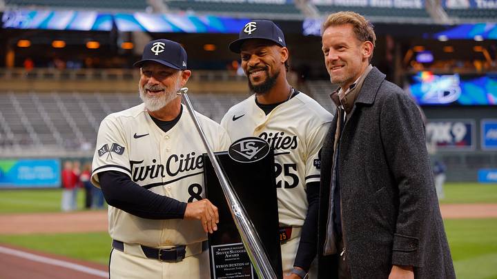 Apr 4, 2026; Minneapolis, Minnesota, USA; Minnesota Twins designated hitter Byron Buxton (25) displays his 2025 silver slugger award with manager Derek Shelton and owner Tom Pohlad before the game with the Tampa Bay Rays at Target Field. Mandatory Credit: Bruce Kluckhohn-Imagn Images