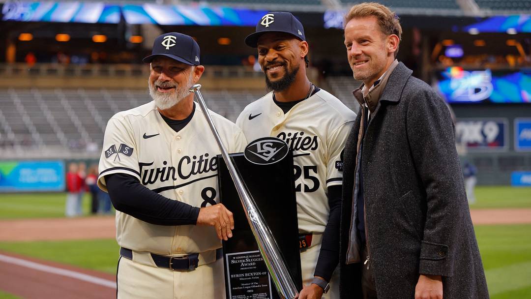Minnesota Twins designated hitter Byron Buxton (25) displays his 2025 silver slugger award with manager Derek Shelton and owner Tom Pohlad.