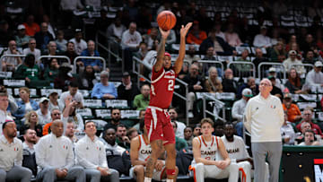Dec 3, 2024; Coral Gables, Florida, USA; Arkansas Razorbacks guard Boogie Fland (2) shoots the basketball against the Miami Hurricanes during the first half at Watsco Center. Mandatory Credit: Sam Navarro-Imagn Images
