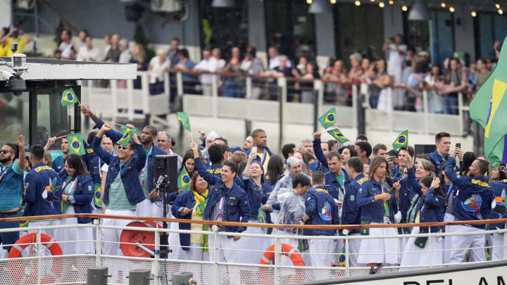 Jul 26, 2024; Paris, FRANCE; The delegation from Brazil waves to the crowd during the Opening Ceremony for the Paris 2024 Olympic Summer Games. Mandatory Credit: Andrew Nelles-USA TODAY Sports