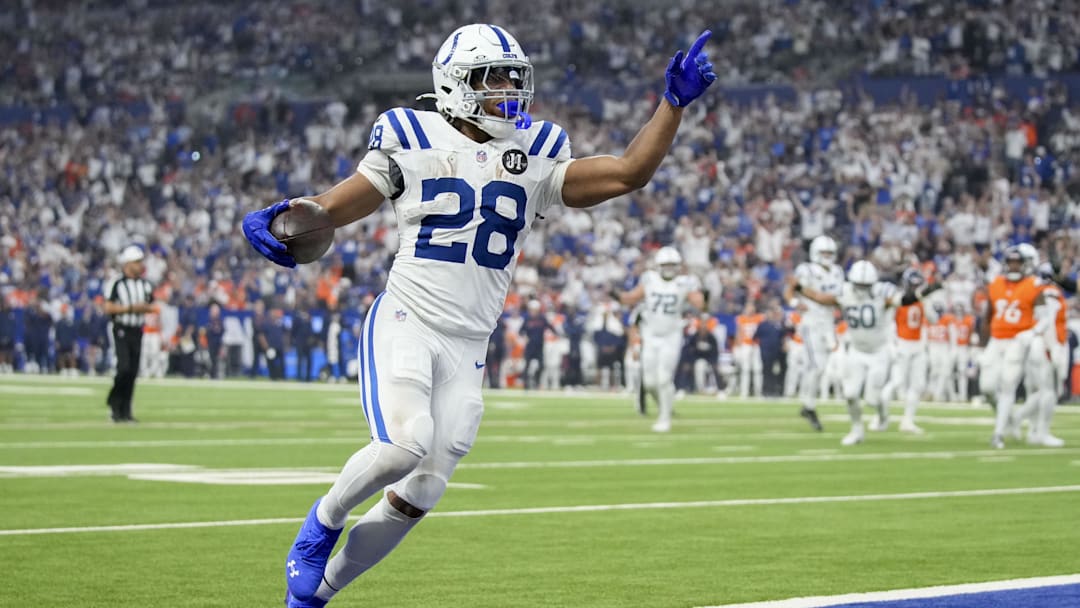 Sep 14, 2025; Indianapolis, Indiana, USA; Indianapolis Colts running back Jonathan Taylor (28) rushes for a touchdown during a game against the Denver Broncos at Lucas Oil Stadium.