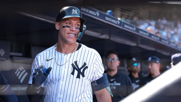 Aug 11, 2024; Bronx, New York, USA; New York Yankees center fielder Aaron Judge (99) reacts in the dugout after his solo home run during the seventh inning against the Texas Rangers at Yankee Stadium.