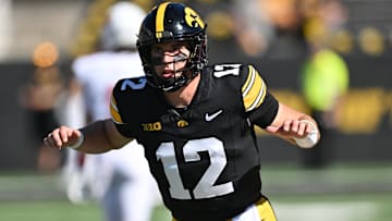 Aug 31, 2024; Iowa City, Iowa, USA; Iowa Hawkeyes quarterback Cade McNamara (12) warms up before the game against the Illinois State Redbirds at Kinnick Stadium.