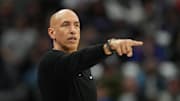 Doug Christie points during the Kings' game against the Bucks.